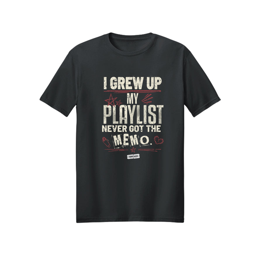 Front of black T-shirt with cream “I Grew Up, My Playlist Never Got the Memo” lettering and red star and heart doodles.